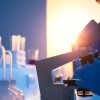 picture of a microscope and sunrise in the background